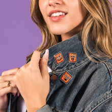 Cargar imagen en el visor de la galería, Young woman wearing three Cinnamon Toast Crunch Cinnamoji Pins on her denim jacket.
