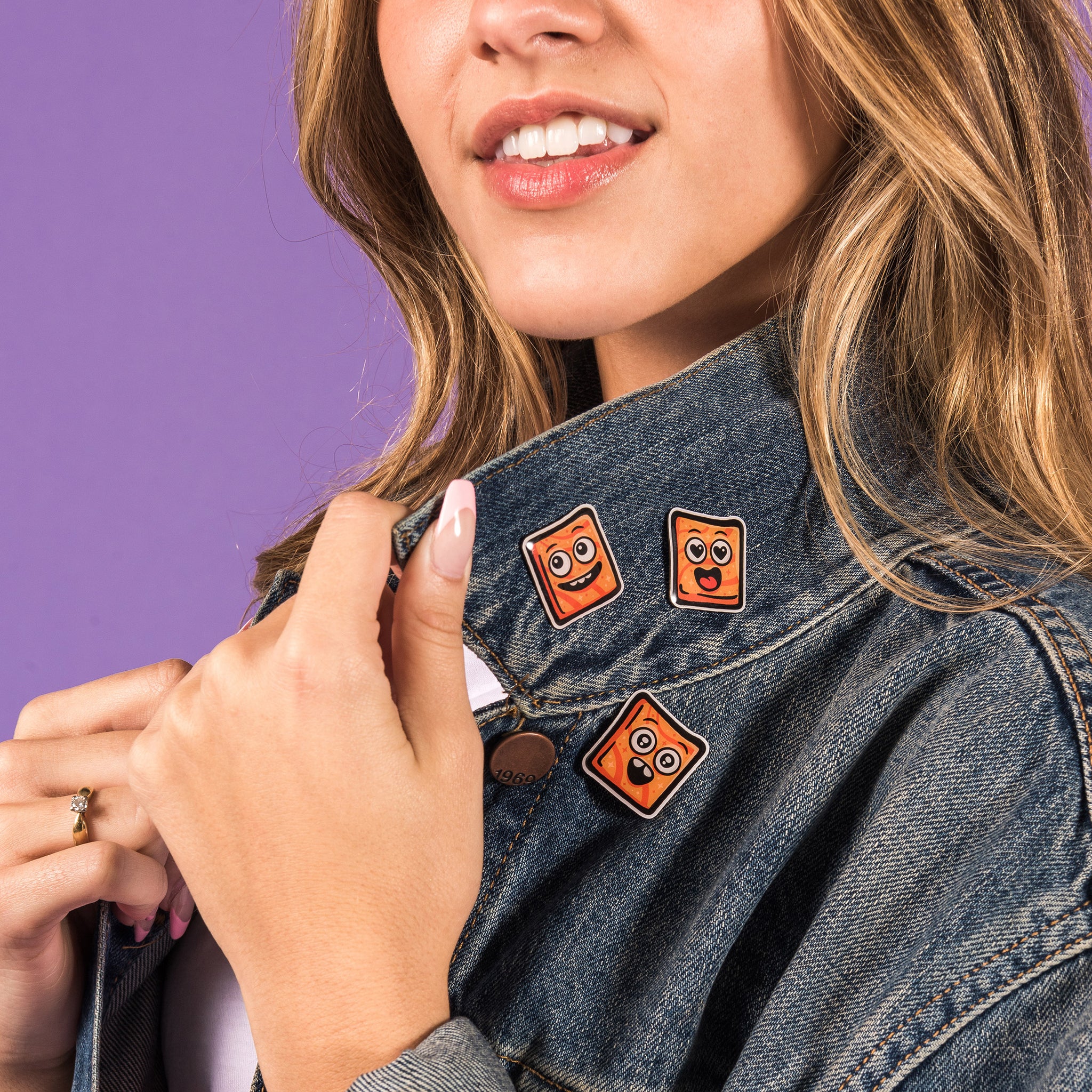 Cinnamon Toast Crunch Cinnamoji Pins pinned on a woman's jacket